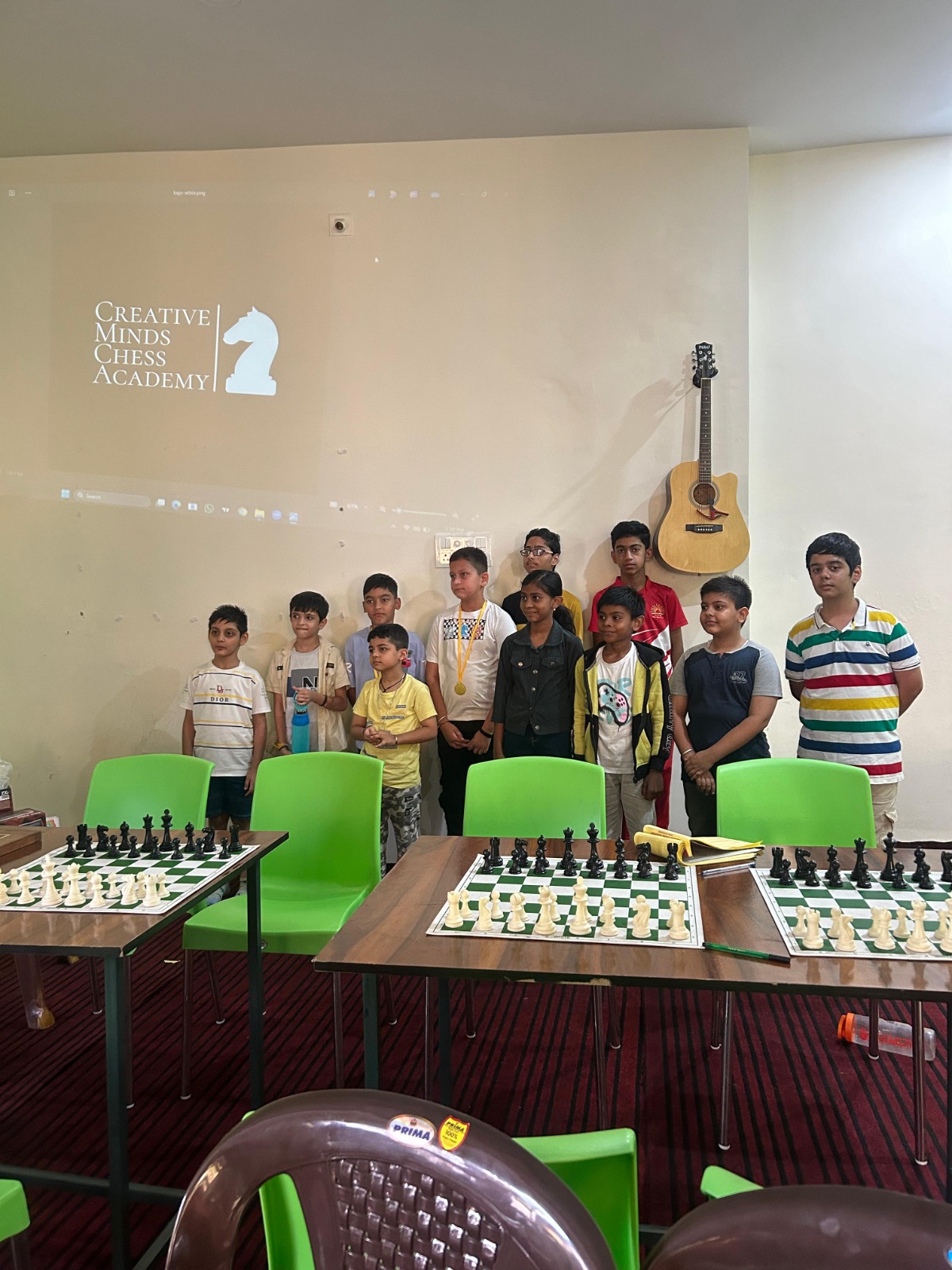 Students playing chess together at the academy
