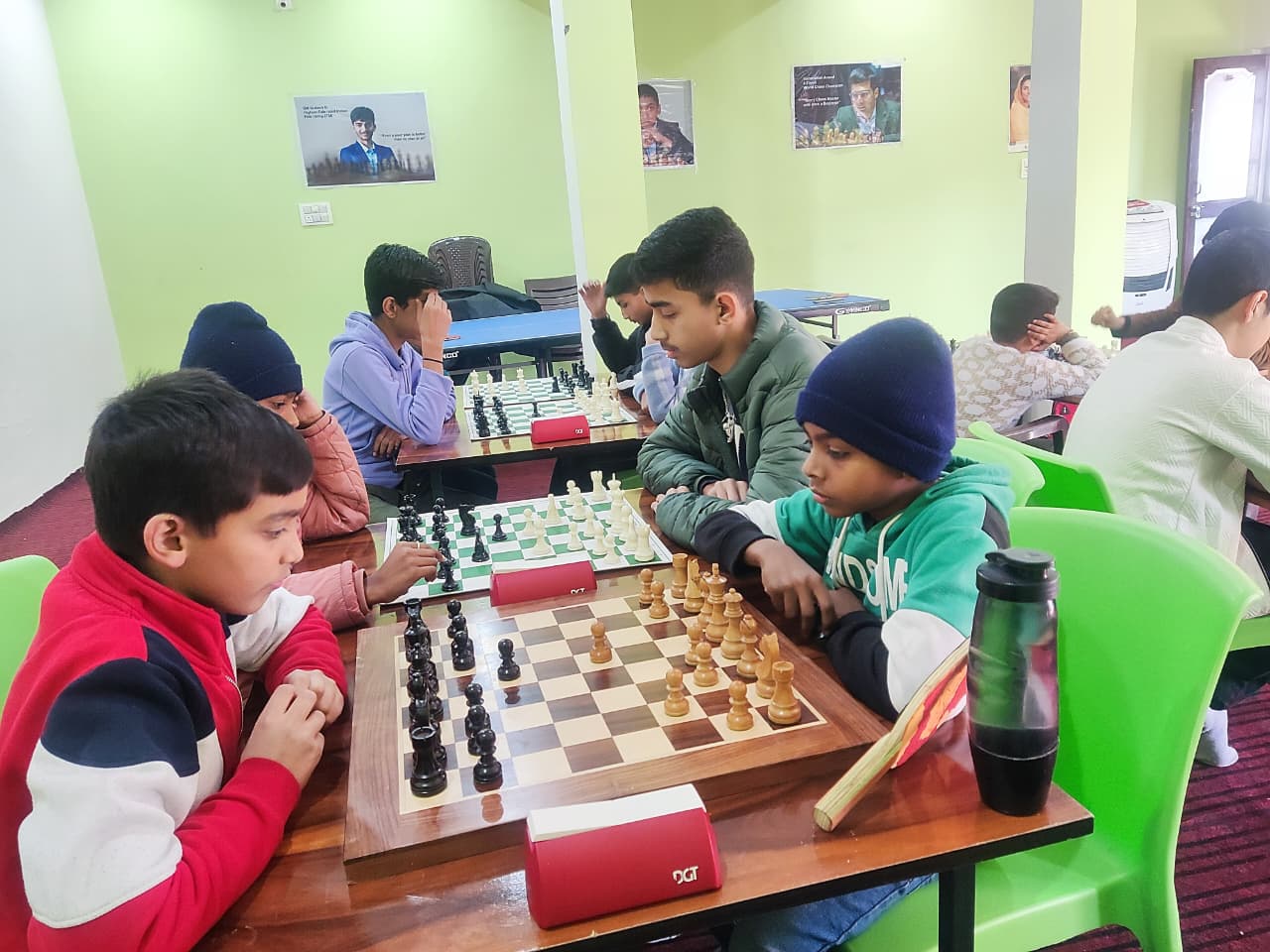 Children participating in a chess tournament at the academy